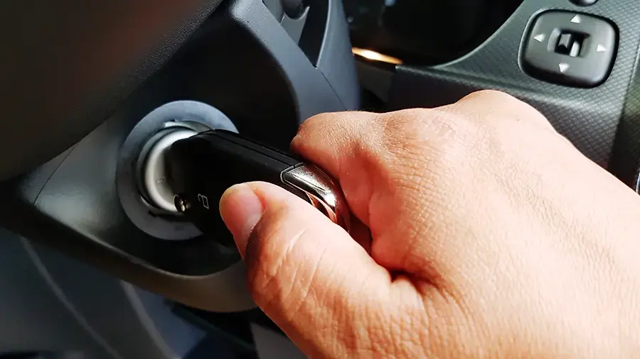 Automotive locksmith cutting and programming a new car key in Austin, Texas